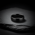 LUMEN Obsidian Steel Ring on dark slate surface