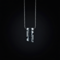 LUMEN Core Minimalist Pendant gunmetal cylinder on dark background
